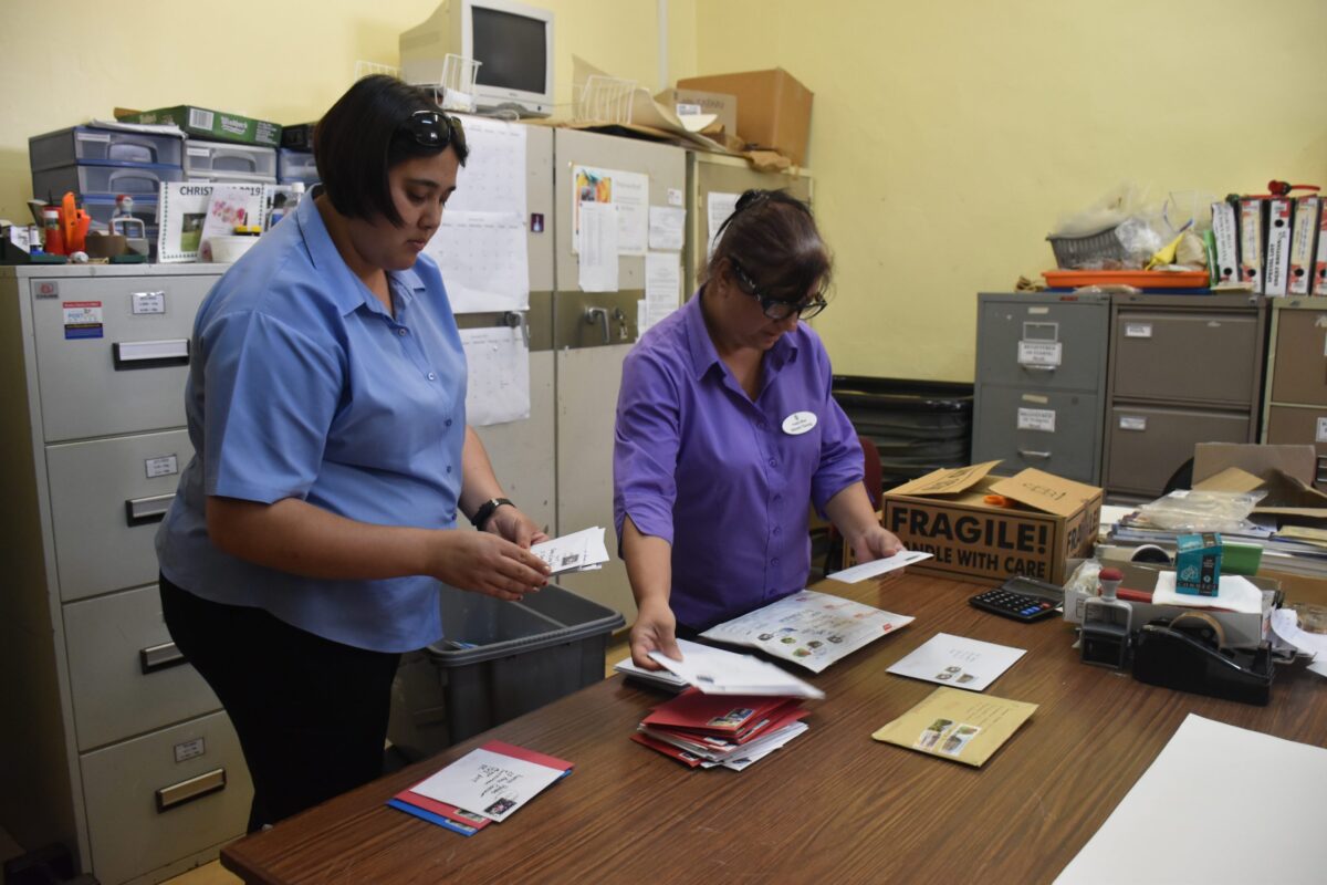 Postal-Officers-sorting-mail – St Helena