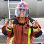 Claire in full fire fighting gear 