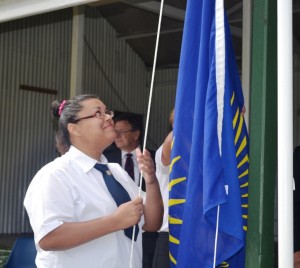 Student Vice-President Chrystabel Greentree Raises the Commonwealth Flag